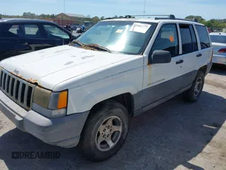 1996 Jeep Grand Cherokee Laredo with VIN 1J4EX58S6TC126610, listed as a IAAI auction lot 41801779 with 1 mi miles. Bid and sale history available at carsss.com. Image 2.