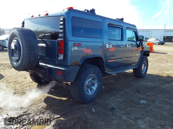2005 Hummer H2 SUV with VIN 5GRGN23U15H117796, listed as a IAAI auction lot 41543913 with 195,560 mi miles. Bid and sale history available at carsss.com. Image 4.