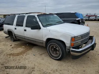 1999 Chevrolet Suburban with VIN 1GNEC16R7XJ418169, listed as a Copart auction lot 88995495 with 2,015,240 mi miles and Salvage title. Bid and sale history available at DreamBid. Image 4.