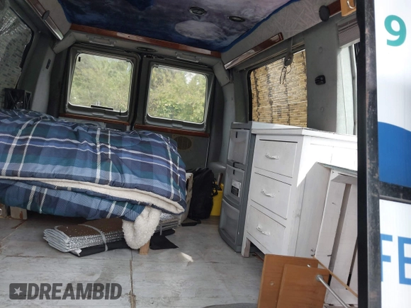1999 Ford Econoline Cargo with VIN 1FDRE14WXXHB72976, listed as a IAAI auction lot 37688871 with 135,319 mi miles. Bid and sale history available at carsss.com. Image 8.