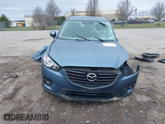 2016 Mazda CX-5 Touring with VIN JM3KE4CY8G0858045, listed as a IAAI auction lot 41941537 with 103,532 mi miles. Bid and sale history available at carsss.com. Image 12.