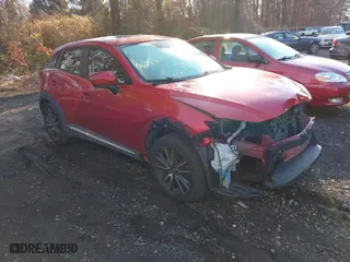 2017 Mazda CX-3 Grand Touring with VIN JM1DKFD77H0165528, listed as a IAAI auction lot 40942595 with NaN miles. Bid and sale history available at carsss.com. Image 1.