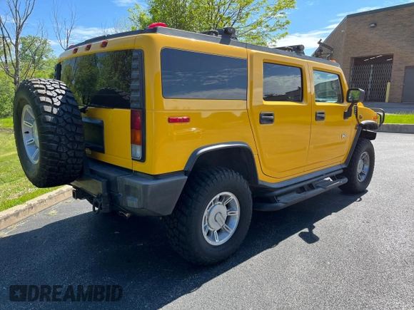 2003 Hummer H2 with VIN 5GRGN23UX3H112710, listed as a Copart auction lot 72082654 with 64,186 mi miles and Salvage Title. Bid and sale history available at carsss.com. Image 4.
