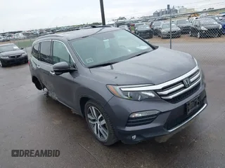 2017 Honda Pilot Touring with VIN 5FNYF6H95HB093151, listed as a IAAI auction lot 42376325 with 117,987 mi miles and . Bid and sale history available at DreamBid. Image 1.
