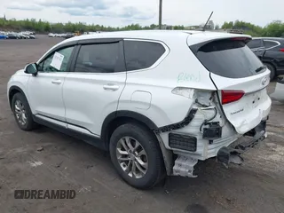 2019 Hyundai Santa Fe SE z VIN 5NMS2CADXKH005960, wystawiony jako IAAI lot #42341142 z przebiegiem 71 617 mil mil oraz . Historia ofert i sprzedaży dostępna na DreamBid. Obrazek 3.