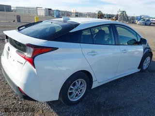 2021 Toyota Prius L Eco with VIN JTDKAMFU9M3150667, listed as a IAAI auction lot 41609328 with 59,177 mi miles. Bid and sale history available at carsss.com. Image 4.