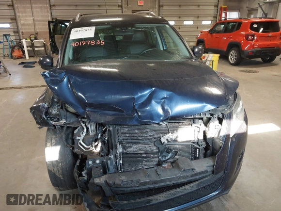 2011 Volkswagen Tiguan SE with VIN WVGBV7AXXBW533872, listed as a IAAI auction lot 40197835 with 104,685 mi miles and . Bid and sale history available at DreamBid. Image 12.