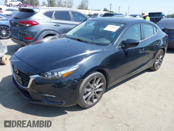 2018 Mazda 3 Touring z VIN 3MZBN1V33JM276803, wystawiony jako IAAI lot #42100422 z przebiegiem 41 802 mil mil oraz . Historia ofert i sprzedaży dostępna na DreamBid. Obrazek 2.
