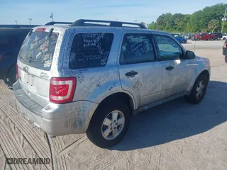 2010 Ford Escape XLT with VIN 1FMCU0D7XAKD16869, listed as a IAAI auction lot 41884141 with 145,781 mi miles. Bid and sale history available at carsss.com. Image 4.