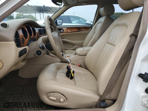 1999 Jaguar XJ with VIN SAJHX1040XC864208, listed as a Copart auction lot 59748585 with 130,577 mi miles and Clean title. Bid and sale history available at DreamBid. Image 7.
