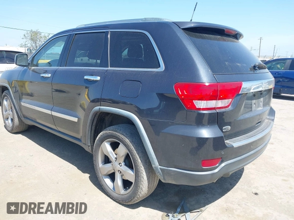 2013 Jeep Grand Cherokee Overland with VIN 1C4RJECT8DC534021, listed as a IAAI auction lot 42058374 with 137,289 mi miles. Bid and sale history available at carsss.com. Image 3.