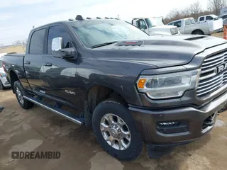 2023 Ram 2500 Laramie with VIN 3C6UR5FJ6PG614424, listed as a IAAI auction lot 41738720 with 28,423 mi miles and . Bid and sale history available at DreamBid. Image 1.