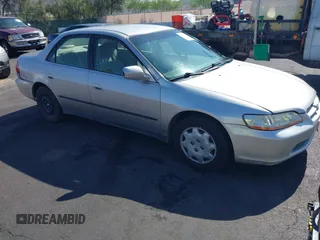 1999 Honda Accord LX z VIN JHMCG6650XC011621, wystawiony jako IAAI lot #42401527 z przebiegiem 243 227 mil mil oraz . Historia ofert i sprzedaży dostępna na DreamBid. Obrazek 1.