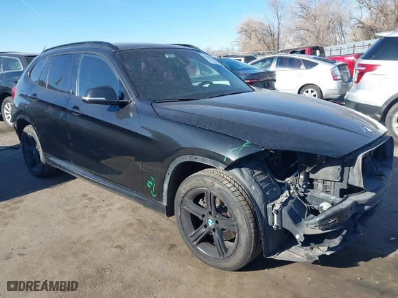 2014 BMW X1 xDrive28i with VIN WBAVL1C58EVY11143, listed as a IAAI auction lot 41396236 with 115,667 mi miles. Bid and sale history available at carsss.com. Image 1.