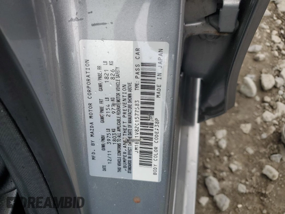 2012 Mazda 3 i Touring with VIN JM1BL1V82C1577583, listed as a Copart auction lot 58669235 with 89,872 mi miles and Salvage title. Bid and sale history available at DreamBid. Image 12.