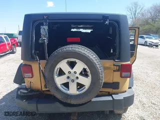 2013 Jeep Wrangler Sport with VIN 1C4AJWAG8DL676619, listed as a IAAI auction lot 41942627 with 130,306 mi miles. Bid and sale history available at carsss.com. Image 6.