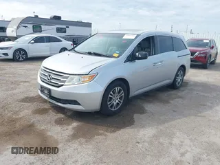 2013 Honda Odyssey EX-L with VIN 5FNRL5H69DB022042, listed as a IAAI auction lot 41902796 with 178,198 mi miles and . Bid and sale history available at carsss.com. Image 2.