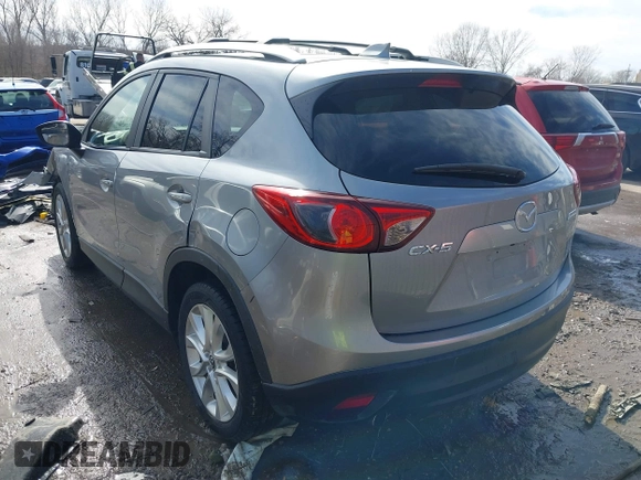 2014 Mazda CX-5 Grand Touring with VIN JM3KE2DY8E0375025, listed as a IAAI auction lot 41657755 with 103,601 mi miles. Bid and sale history available at carsss.com. Image 3.