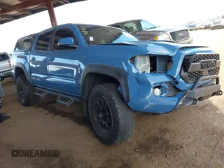 2019 Toyota Tacoma SR z VIN 3TMCZ5AN8KM276615, wystawiony jako IAAI lot #42202432 z przebiegiem 58 146 mil mil oraz . Historia ofert i sprzedaży dostępna na DreamBid. Obrazek 1.