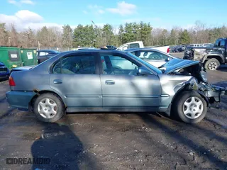 1999 Honda Civic EX with VIN 2HGEJ8643XH511334, listed as a IAAI auction lot 41851364 with 142,632 mi miles. Bid and sale history available at carsss.com. Image 13.