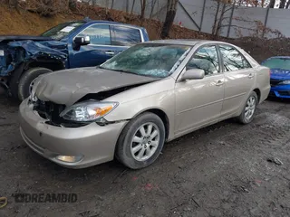 2003 Toyota Camry LE with VIN 4T1BE30K13U705105, listed as a IAAI auction lot 41696395 with 191,389 mi miles and . Bid and sale history available at DreamBid. Image 2.