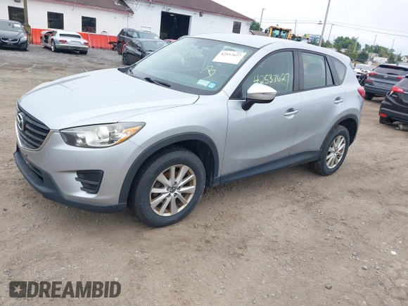 2016 Mazda CX-5 Sport z VIN JM3KE4BY1G0711602, wystawiony jako IAAI lot #42537627 z przebiegiem Nie podano mil oraz . Historia ofert i sprzedaży dostępna na DreamBid. Obrazek 17.