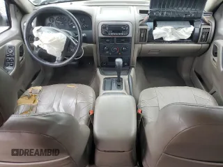 2004 Jeep Grand Cherokee Laredo with VIN 1J4GX48SX4C201569, listed as a Copart auction lot 58631585 with 271,124 mi miles and Salvage title. Bid and sale history available at DreamBid. Image 8.