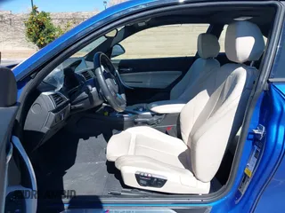 2015 BMW 2 Series M235i with VIN WBA1J7C59FV254140, listed as a IAAI auction lot 41642427 with 23,957 mi miles and . Bid and sale history available at carsss.com. Image 5.