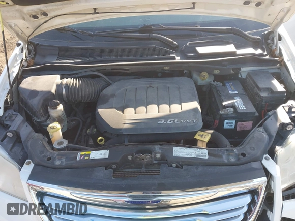 2013 Chrysler Town & Country Touring with VIN 2C4RC1BG8DR573559, listed as a IAAI auction lot 41793874 with 205,005 mi miles. Bid and sale history available at carsss.com. Image 10.