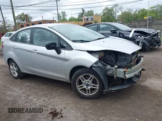 2017 Ford Fiesta SE z VIN 3FADP4BJ7HM138644, wystawiony jako IAAI lot #42260313 z przebiegiem 127 264 mil mil oraz . Historia ofert i sprzedaży dostępna na DreamBid. Obrazek 1.