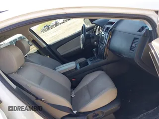 2015 Mazda CX-9 Touring with VIN JM3TB3CV1F0461403, listed as a IAAI auction lot 42148325 with 143,452 mi miles. Bid and sale history available at carsss.com. Image 5.