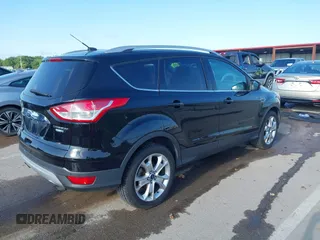 2016 Ford Escape Titanium with VIN 1FMCU9J97GUC21242, listed as a IAAI auction lot 42431567 with 96,946 mi miles and . Bid and sale history available at DreamBid. Image 4.