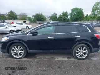 2012 Mazda CX-9 Grand Touring z VIN JM3TB3DV1C0360212, wystawiony jako IAAI lot #42232584 z przebiegiem 99 582 mil mil oraz . Historia ofert i sprzedaży dostępna na DreamBid. Obrazek 14.