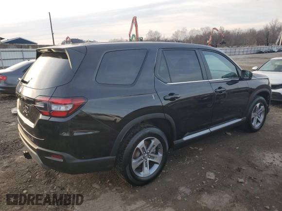 2024 Honda Pilot EX-L 7 Passenger with VIN 5FNYG1H51RB019899, listed as a Copart auction lot 82653994 with 7,399 mi miles and Salvage Title. Bid and sale history available at carsss.com. Image 3.