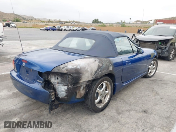 1999 Mazda MX-5 Miata with VIN JM1NB3531X0136037, listed as a IAAI auction lot 42196338 with Not provided miles and . Bid and sale history available at DreamBid. Image 4.