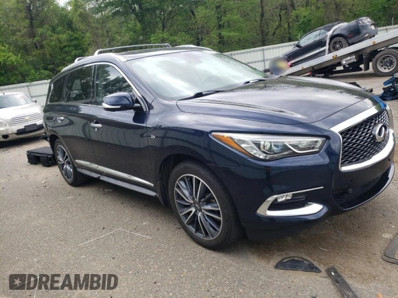 2019 Infiniti QX60 Luxe with VIN 5N1DL0MN4KC560857, listed as a Copart auction lot 52021725 with 104,013 mi miles and Salvage Title. Bid and sale history available at DreamBid. Image 4.