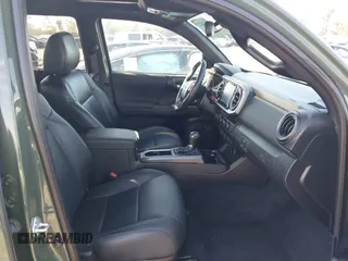 2021 Toyota Tacoma SR z VIN 3TMCZ5AN7MM395940, wystawiony jako IAAI lot #41860127 z przebiegiem 39 338 mil mil oraz . Historia ofert i sprzedaży dostępna na DreamBid. Obrazek 5.