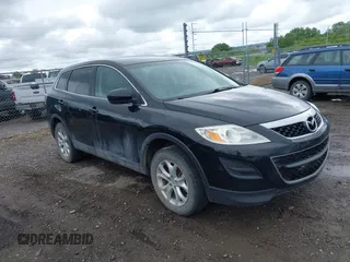 2011 Mazda CX-9 Touring z VIN JM3TB2CA1B0316900, wystawiony jako IAAI lot #42377313 z przebiegiem 152 534 mil mil oraz . Historia ofert i sprzedaży dostępna na DreamBid. Obrazek 1.