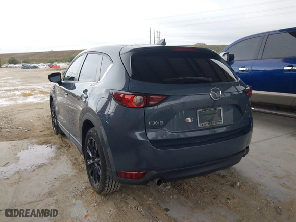 2021 Mazda CX-5 Touring with VIN JM3KFACM0M0327832, listed as a IAAI auction lot 41989199 with 42,396 mi miles. Bid and sale history available at carsss.com. Image 3.