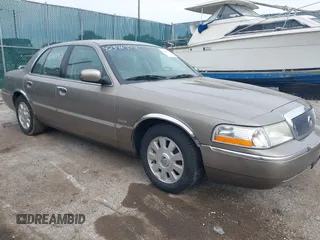 2003 Mercury Grand Marquis LS Premium z VIN 2MEFM75W93X626557, wystawiony jako IAAI lot #42346952 z przebiegiem 116 587 mil mil oraz . Historia ofert i sprzedaży dostępna na DreamBid. Obrazek 1.