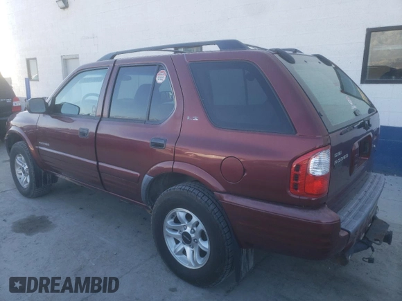 2002 Isuzu Rodeo S with VIN 4S2DM58W824313096, listed as a Copart auction lot 77951364 with 127,470 mi miles and Salvage Title. Bid and sale history available at DreamBid. Image 2.