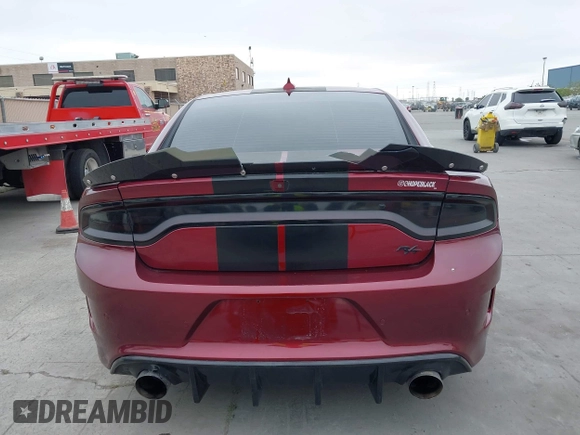 2019 Dodge Charger R/T with VIN 2C3CDXCT2KH749207, listed as a IAAI auction lot 42120658 with 52,330 mi miles and . Bid and sale history available at carsss.com. Image 16.