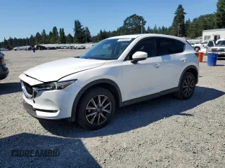 2018 Mazda CX-5 Grand Touring with VIN JM3KFBDM0J0419989, listed as a Copart auction lot 62868005 with 120,217 mi miles and Salvage title. Bid and sale history available at DreamBid. Image 1.