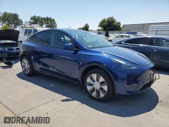 2024 Tesla Model Y z VIN 7SAYGDED9RF005104, wystawiony jako Copart lot #64974545 z przebiegiem 20 422 mil mil oraz Szkoda całkowita • Salvage title. Historia ofert i sprzedaży dostępna na DreamBid. Obrazek 4.
