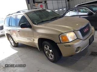 2004 GMC Envoy SLE with VIN 1GKDT13S442136464, listed as a IAAI auction lot 41874304 with 250,330 mi miles. Bid and sale history available at carsss.com. Image 1.