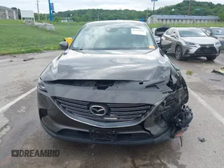 2017 Mazda CX-9 Touring z VIN JM3TCACY7H0129335, wystawiony jako IAAI lot #42289926 z przebiegiem 60 425 mil mil oraz . Historia ofert i sprzedaży dostępna na DreamBid. Obrazek 13.