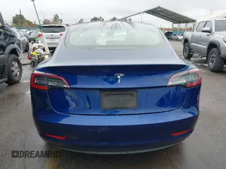2020 Tesla Model 3 Standard Range Plus with VIN 5YJ3E1EAXLF644679, listed as a IAAI auction lot 41500595 with 53,726 mi miles and . Bid and sale history available at DreamBid. Image 16.