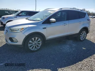 2017 Ford Escape Titanium with VIN 1FMCU0J90HUB04082, listed as a Copart auction lot 77814994 with 135,674 mi miles and Salvage Title. Bid and sale history available at carsss.com. Image 1.
