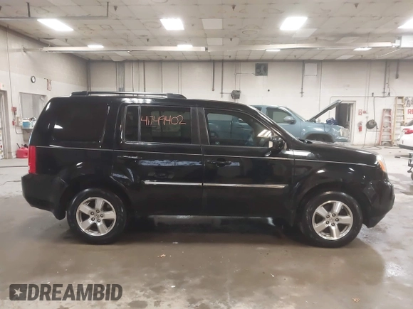 2012 Honda Pilot Touring with VIN 5FNYF4H91CB067014, listed as a IAAI auction lot 41749402 with 151,248 mi miles. Bid and sale history available at carsss.com. Image 13.