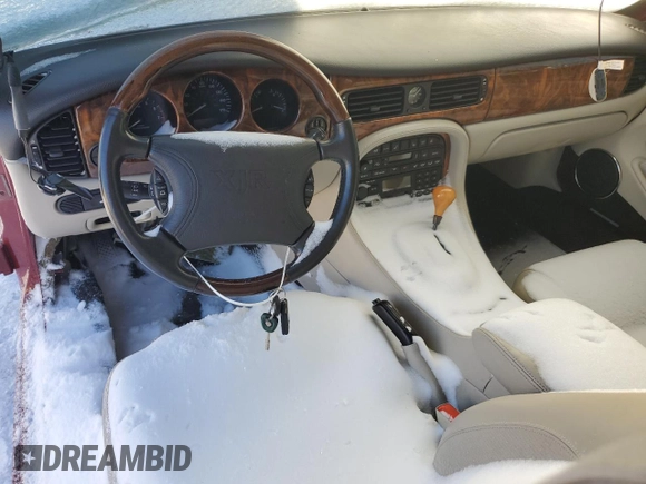 1999 Jaguar XJ with VIN SAJPD1841XC869913, listed as a Copart auction lot 41449445 with Not provided miles and Salvage title. Bid and sale history available at DreamBid. Image 8.